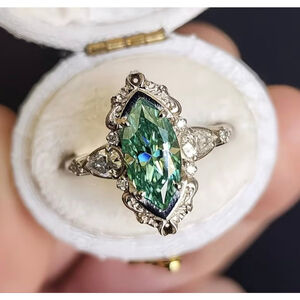 Vintage-Inspired Green Gemstone Marquise Ring with Diamond Accents